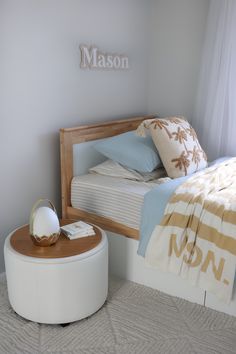 a bedroom with a bed, night stand and nightstand