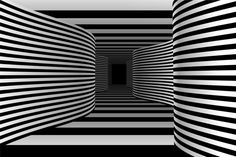 an abstract black and white striped tunnel with the light at the end going through it