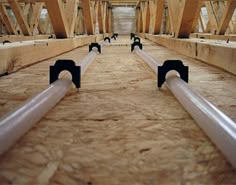 pipes are lined up in the middle of an unfinished building