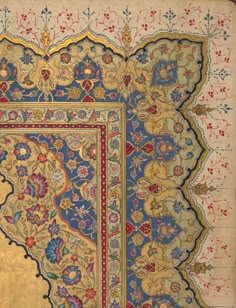 an intricately decorated rug with gold and blue trimmings, in the shape of a rectangle