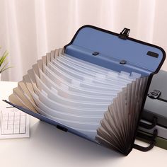 an open briefcase sitting on top of a desk