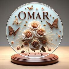 there is a glass plate with flowers and butterflies on it that says omar in the center