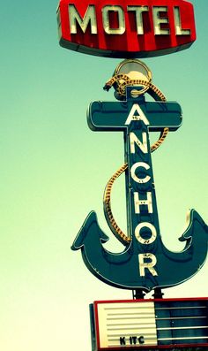 an anchor sign on top of a motel