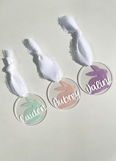 three round stickers with the words susan, auburn and lauren written in different colors