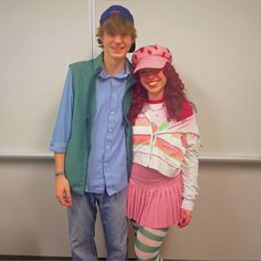 a man and woman dressed up in costumes