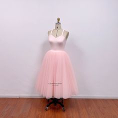 This pearl pink tutu dress is inspired by Carrie sage green tulle dress from iconic 90s TV show. I use crepe fabric to  make the top, and the skirt has 9 layers of tulle fabric, so the skirt is puffy with enough volume. I can custom this Carrie inspired tulle skirt in different colors. This dress can be made to order in custom size. For custom size, please message me your bust/waist/hips measurements and your height. Below are the measurements of standard size 2 to size 12 in inches: Size 2(inches): Bust=32 Waist=25 Hips=35 Height=65 Size 4(inches): Bust=33 Waist=26 Hips=36 Height=65 Size 6(inches): Bust=34 Waist=27 Hips=37 Height=65 Size 8(inches): Bust=35 Waist=28 Hips=38 Height=65  Size 10(inches): Bust=36 Waist=29 Hips=39 Height=65 Size 12(inches): Bust=38 Waist=31 Hips =41 Height=65 Summer Pink Tulle Tutu Dress, Sleeveless Balletcore Party Dress, Pink Tulle Tutu Dress For Spring, Spring Pink Tulle Tutu Dress, Fitted Pink Tutu Dress For Summer, Summer Princess Fairy Dress With Tulle Skirt, Spring Fairy Dress For Party In Balletcore Style, Summer Princess Style Fairy Dress With Tulle Skirt, Summer Fitted Fairy Dress With Tulle Skirt