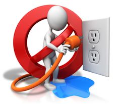 a person plugging an outlet in the wall with a red and orange power cord