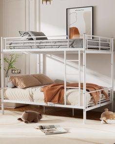 a white bunk bed sitting on top of a wooden floor