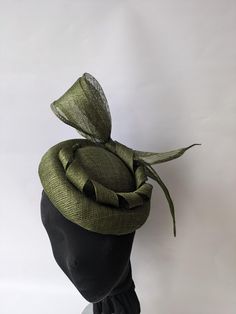 Looking for the perfect headwear to complete your look for a special event? Look no further than our 'Olive green Pillbox Hat'! Crafted from high-quality sinamay material, this stunning pillbox hat features delicate flowers and sinamay strips attached to an elastic band, making it comfortable and secure to wear throughout the day. The Olive color adds a touch of elegance and sophistication, making it an excellent choice for weddings or races. This hat is sure to turn heads with its unique design Vintage Green Wedding Hat, Olive Green Fascinator, Pillbox Hats With Veil, Elegant Green Hat Headpiece, Green Evening Fascinator Hat, Olive Green Hat, Green Fascinator, Mini Hats, Hat Party