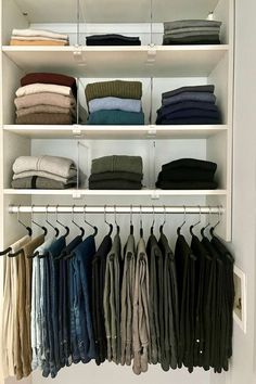 an organized closet with folded clothes and folded shirts