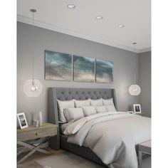 a bedroom with gray walls and white bedding, two pictures on the wall above the bed