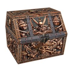 an intricately decorated wooden box with skulls and swords on the lid, is shown against a white background