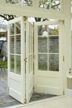 an open white door leading to a patio