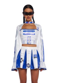 a woman wearing a white and blue dress with a star wars costume on it's chest