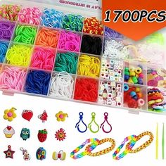 lots of different types of beads and accessories in a plastic box with stickers on it