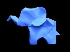 an origami elephant is shown against a black background