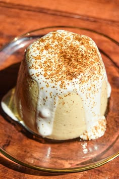 a dessert on a glass plate with cinnamon sprinkles