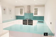 a kitchen with blue counter tops and white cabinets