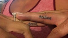 two people with matching tattoos on their fingers