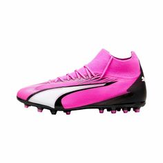 a pink and black soccer shoe on a white background