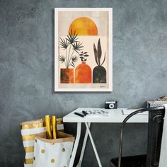 a desk with a bag and some books on it next to a chair in front of a gray wall