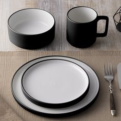 black and white dinnerware set on a place mat