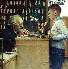 an old man and young boy standing in front of a store counter with items on display