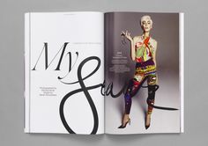 an open magazine with a woman in colorful clothes