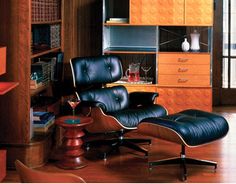 an eames chair and ottoman in a living room