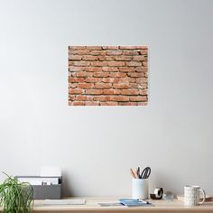 a brick wall is shown behind a desk