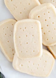 several pieces of shortbread sitting on top of a white plate