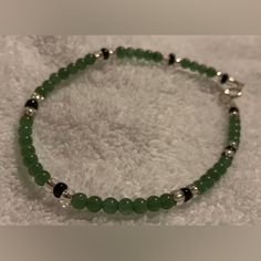 New Handmade Green Dyed Jade W/Black & Silver Accents Ankle Bracelet, Anklet, 9.25” Length Details & Features New, Handmade, High Fashion Costume Jewelry Approx. 9.25” Length Could Be Worn As A Bracelet Or As A Fun Addition To A Convertible Necklace. Strong But Flexible Acculon Triple-Strand Braided Stainless Steel Stringing Wire Sterling Silver-Plated Spring Ring Clasp & Jump Ring Closure & Accent Beads Sterling Silver Findings Dyed Green Jade (Natural Stone) Beads Black Glass Beads Miyuki Ster Ankle Bead Bracelets, Green And Black Bracelet, Casual Black Handmade Anklets, Convertible Necklace, Fancy Jewelry Necklace, Natural Stone Beads, Craft Stuff, Silver Line, Black Bracelets