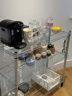 a kitchen cart with various items on it