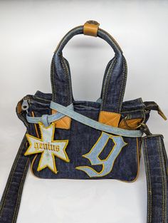 Fake London Genius denim bag, 23x17x12cm. The bag is used, intact, has signs of wear in the form of abrasions on the fabric, abrasions on the metal parts of the fittings, and there is an ink mark on the inner lining of the bag. Distressed Denim Blue Bag For Daily Use, Denim Blue Distressed Bag For Daily Use, London Bag, Ugly Outfits, Denim Bags, Unique Handbags, Diy Fashion Clothing, Fashion Photography Inspiration, Top Handle Bags