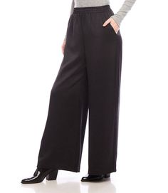 Effortlessly chic and versatile, our wide leg pants are made of luxurious satin material and come in a fashionable full length design.. Available in both black and cognac colors, these pants are the perfect addition to your fall wardrobe. Embrace comfort and style with our must-have pants. Recycled Satin: 55% Polyester 45% Recycled Polyester Made in the USA of Imported Fabric Dry Clean Only Length: Full length Elasticized waistband Front rise: 13 1/8 inches (size M) Inseam: 29 1/4 inches (all si Sleek Silk High-waisted Wide Leg Pants, Silk Wide Leg Pants With Elastic Waistband For Work, Black Silk Wide Leg Bottoms, Black Silk Wide-leg Pants, Elegant High-waisted Viscose Pants, Elegant Wide Leg Viscose Bottoms, Sleek Satin Wide Leg Pants, Chic Black Viscose Wide Leg Pants, Chic Full-length Wide Leg Viscose Pants