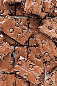 chocolate brownies are stacked on top of each other with holes in the middle to make them look like they have been cut into squares