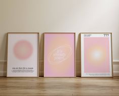 three framed art prints sitting on top of a wooden floor