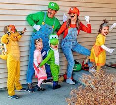 a group of people in costumes standing next to each other