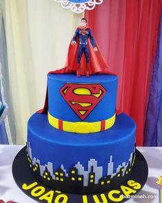 a birthday cake with superman on top