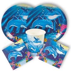 dolphin party supplies including plates, cups and napkins