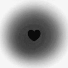 a black and white photo with a heart in the center, taken from inside an object