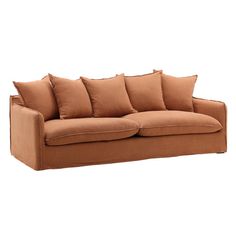 a brown couch with six pillows on it's back and one arm facing the camera