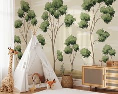 a child's room with a teepee tent and giraffes on the wall