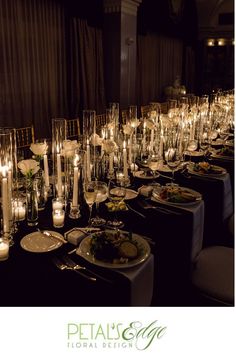 a long table filled with lots of plates and candles