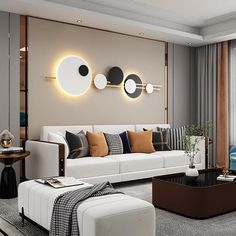 a modern living room with white furniture and round mirrors on the wall above it's windows