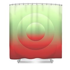 a red and green shower curtain with a circular design on the bottom, in front of a white background