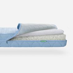 an image of two mattresses stacked on top of each other in the same position