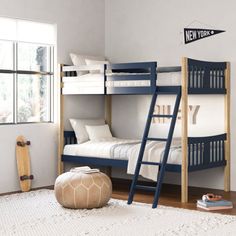 a bedroom with bunk beds and a rug on the floor