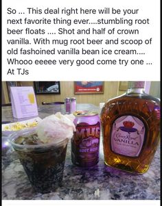 a bottle of booze next to a cup of ice cream on a counter top