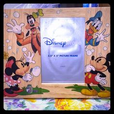 a wooden frame with mickey mouses on it